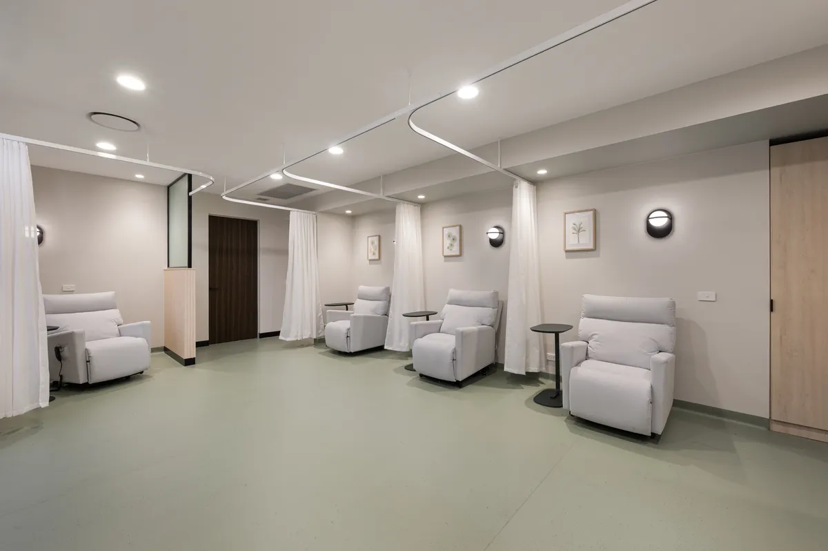Purpose-built infusion room with comfortable recliners and privacy curtains at Hunter Blood Group